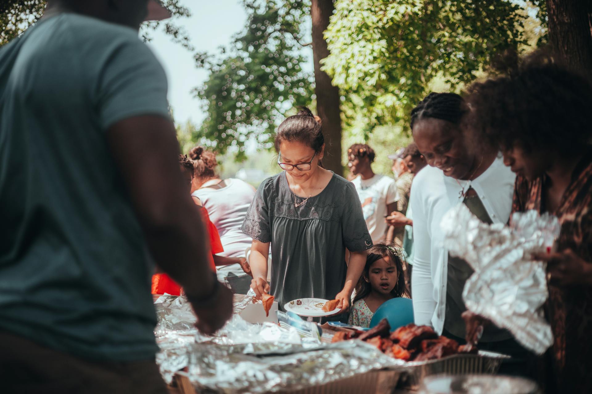 Diverse group sharing food outdoors